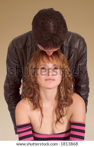 casual couple in love over a brownish background