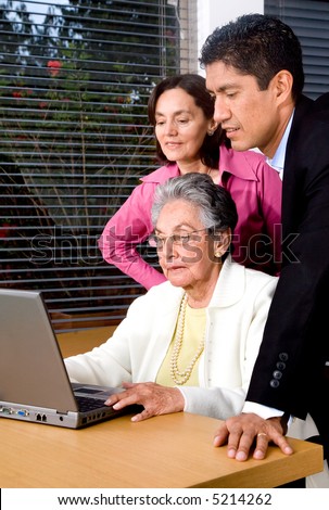 family on a laptop smiling at home