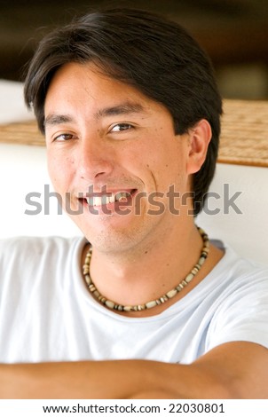 casual male portrait smiling in his summer house