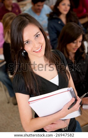 Beautiful female student taking a class at the uni