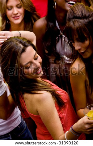Beautiful happy woman partying at a nightclub
