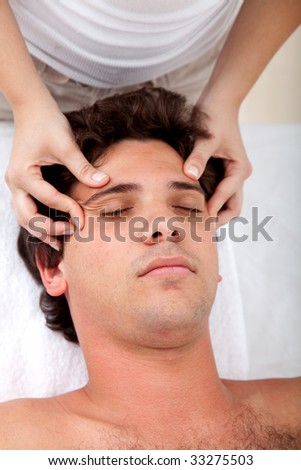 Man getting an anti-stress massage on his face