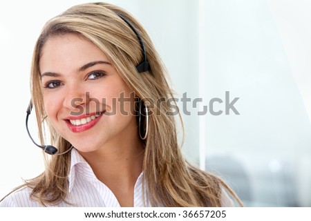 Customer support operator smiling in an office