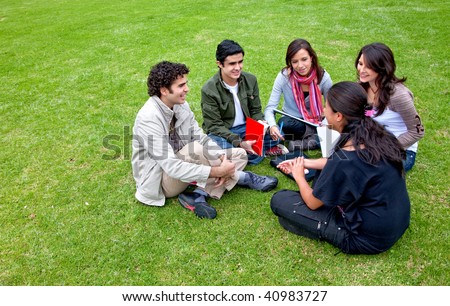 Group of students sitting in a circle outdoors