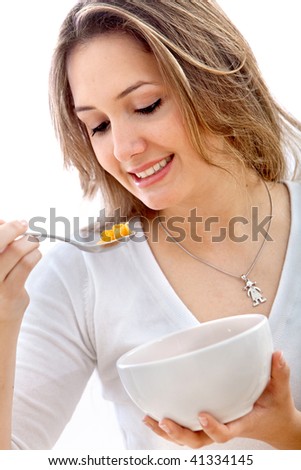 Woman eating cereals isolated over a white background
