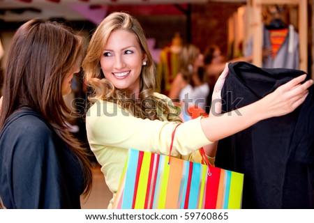 Beautiful women shopping for some clothes at a store