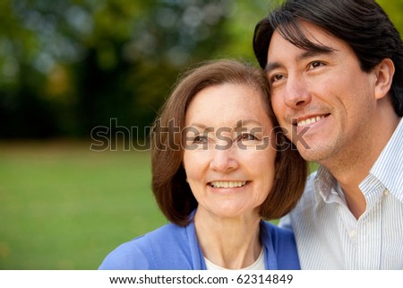 Portrait of a mother and son smiling outdoors