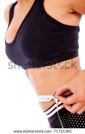 Fit woman measuring her waist ? lose weight concepts