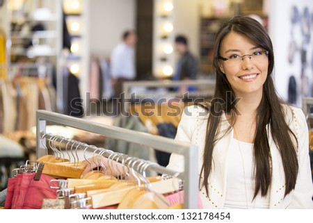 Beautiful casual woman shopping at a retail store