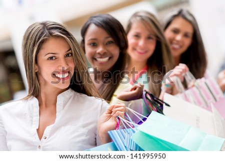 Group of female shoppers in a row at the shopping center