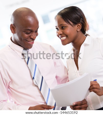 African american business couple working at the office