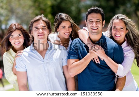 Group of casual young people looking very happy
