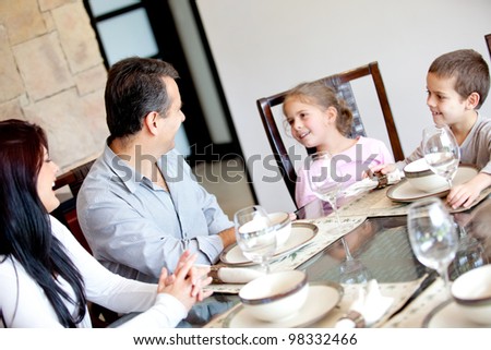 Happy family having dinner in the dinning room
