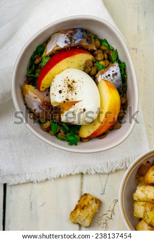 lentil salad with egg, apples and croutons. selective focus
