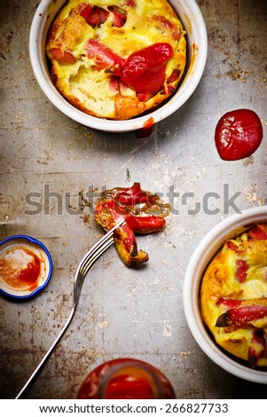 cakes with sausages and ketchup. style vintage. selective focus