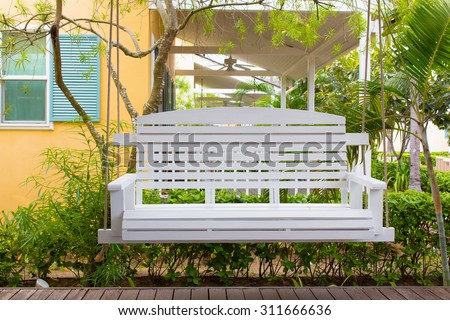 Front porch with a white porch swing