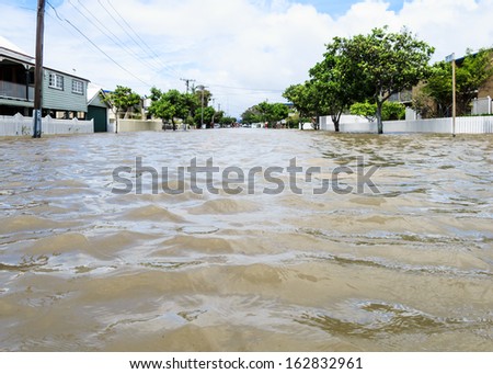 BRISBANE, QLD, AUSTRALIA - January 27: View of the flood water up a Brisbane street during the floods in Sandgate on 27 January 2013 in Brisbane