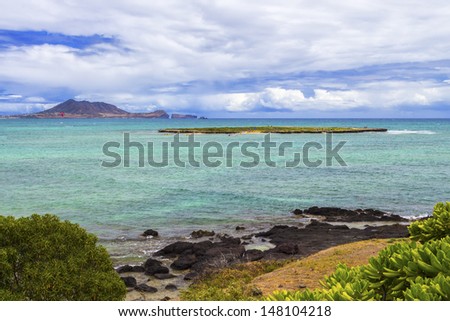 Popoia Island, commonly known as Flat Island, is a state seabird sanctuary off the coast of Kailua on Oahu, Hawaii
