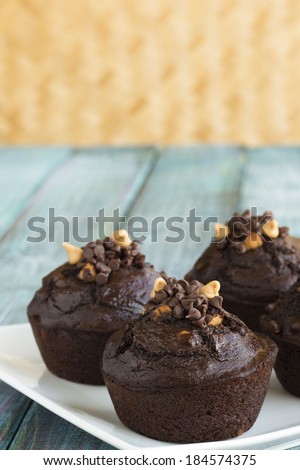 Chocolate muffins filled with peanut butter chips and mini chocolate chips
