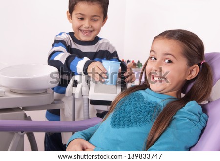 brother and sister in the dental office waiting for doctor