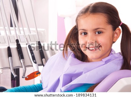 little girl in the dental office waiting for doctor