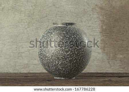 Antique bronze bowl on wooden crack pattern background (Still life)