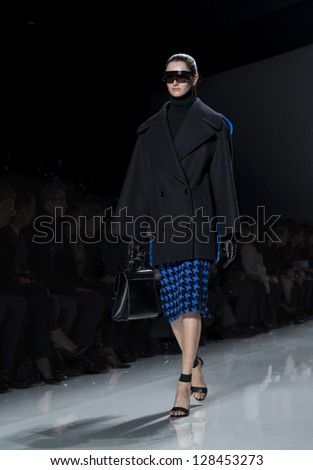 NEW YORK - FEBRUARY 13: A model is walking the runway at Michael Kors Collection for Fall/Winter 2013 during Mercedes-Benz Fashion Week on February 13, 2013 in New York