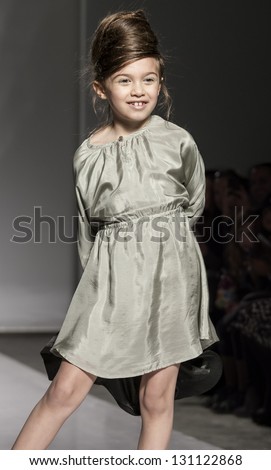 NEW YORK - MARCH 10: A model walks the runway at Pale Cloud Kids Collection Show for Fall/Winter 2013 during NY Kids Fashion Week at Industria Super Studio on March 10, 2013 in New York