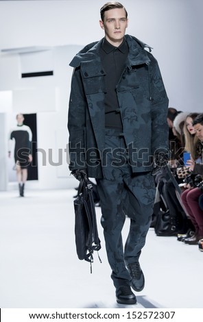 NEW YORK - FEBRUARY 09: A model is walking the runaway at Lacoste Ready to Wear Fall/Winter 2013-2014 fashion show during Mercedes-Benz Fashion Week on February 09, 2013 in New York