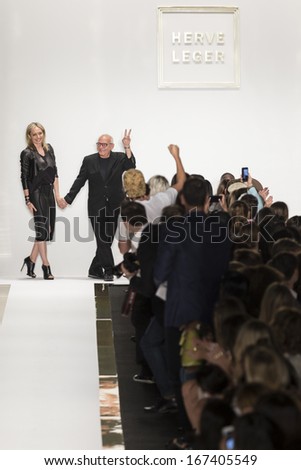 NEW YORK - SEPTEMBER 7: Max and Lubov Azria salute the audience at the Herve Leger by Max Azria fashion show during Mercedes-Benz Fashion Week Spring Summer 2014 on SEPTEMBER 7, 2013 in New York