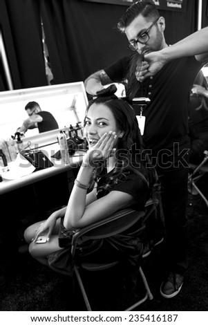 New York - September 04, 2014: Angela Ruiz prepares backstage at the Desigual Spring 2015 fashion show during Mercedes-Benz Fashion Week at The Theatre at Lincoln Center