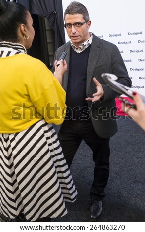New York - February 12, 2015: Managing Director of Desigual Manel Jadraque gives an interview backstage at Desigual Fall 2015 show during Mercedes-Benz Fashion Week at The Theatre at Lincoln Center