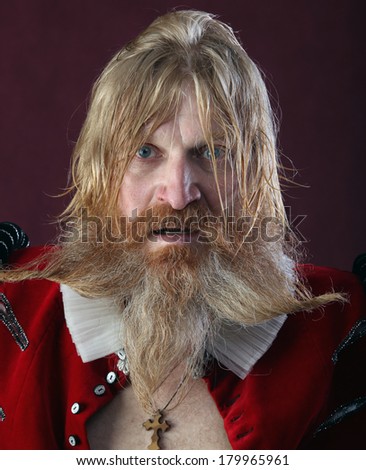 close-up portrait of an adult male with long blonde hair with a beard and mustache crazy kind