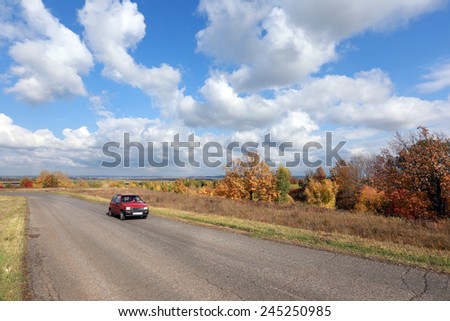 autumn landscape desert road to the horizon in the field and beautiful white clouds in sunny afternoon