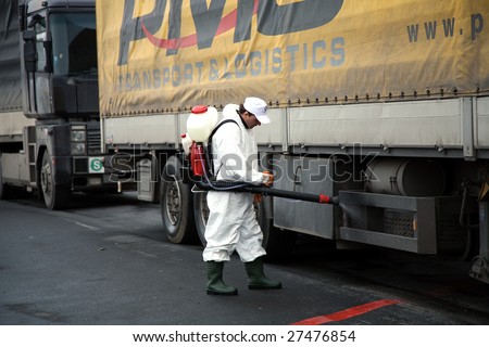 SERBIA – CIRCA MARCH 2006 : An unidentified personnel disinfects vehicles at border crossing point in Serbia, circa Mach 2006. Bird’s flu is an infectious disease of birds occurs worldwide.