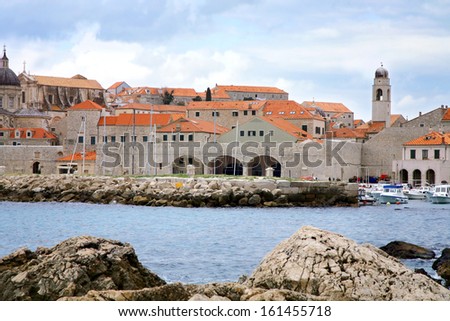 City harbor with cozy backyards in Croatia, Dubrovnik. Famous old town fortress on the Adriatic.