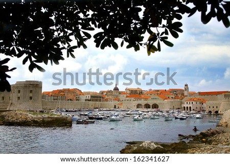 City harbor witCity harbor with cozy backyards in Croatia, Dubrovnik. Famous old town fortress on the Adriatic.h cozy backyards in Croatia, Dubrovnik. Famous old town fortress on the Adriatic.