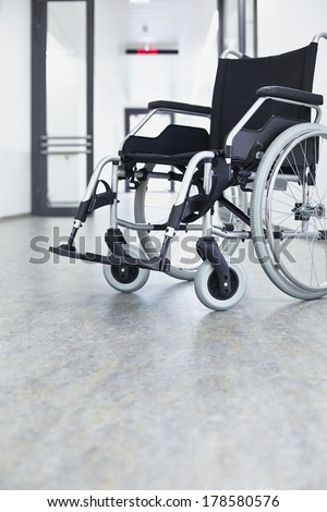 Wheelchair in the hospital in the corridor in front of a door
