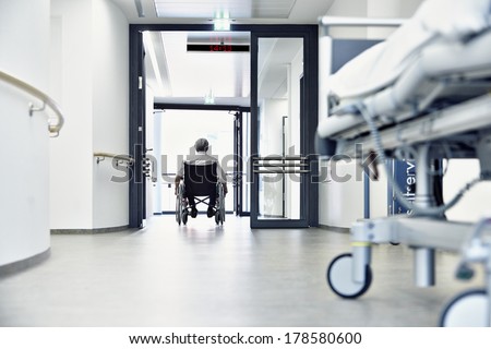 Wheelchair in the hospital corridor with door