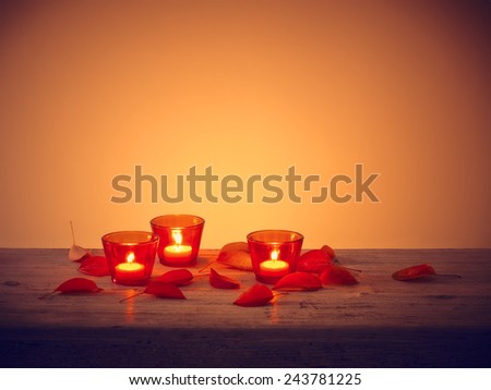 Tealight Candle and leaves on table