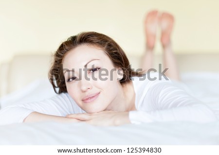 Attractive Asian Mixed Woman in Bed Smiling