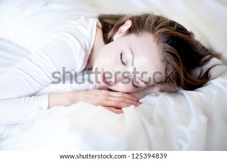 Attractive Asian Mixed Woman sleeping in bed peacefully