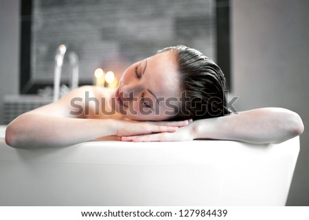 Attractive Mixed Asian Female resting in the bath