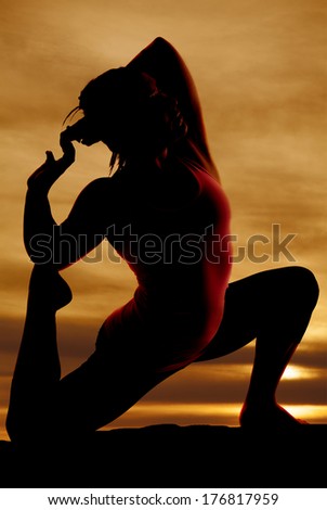 silhouette of strong female model yoga pose