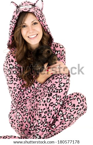 female model holding stuffed animal in pajamas