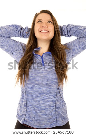 Female model arms behind head stretching smiling