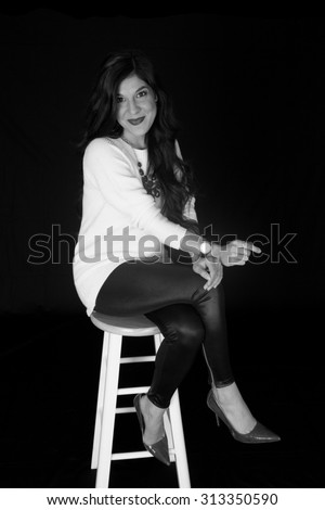 black and white portrait woman on bar stool