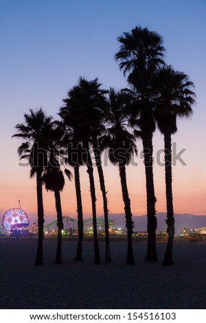 Santa Monica Pier.  This an image of the Santa Monica Pier with silhouettes of palm trees taken just after sunset.