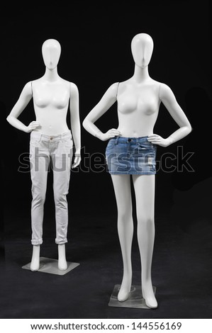full-length Two mannequin dressed in shirt and isolated on black background