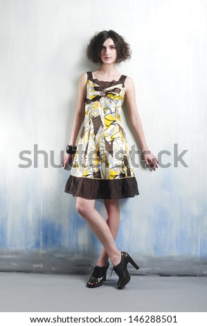 Full body beautiful casual young woman standing posing in studio